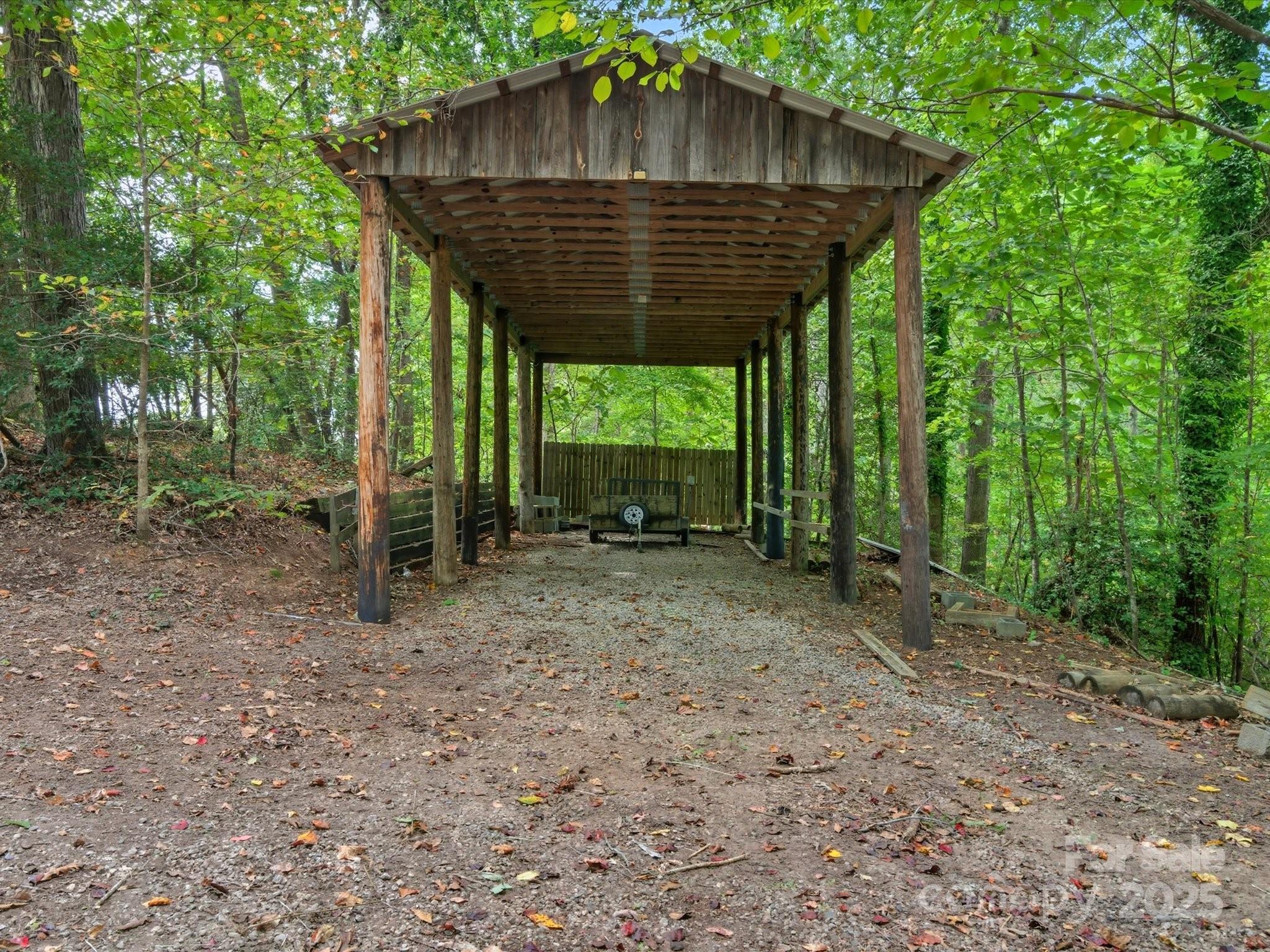 240 Petty Road Gastonia, NC 28056 - Photo 45 of 48 a small barn in the middle of a forest