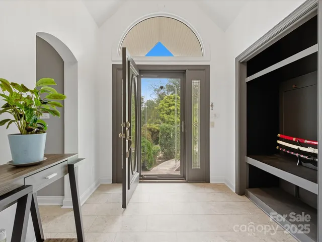 a view of room with furniture and a potted plant