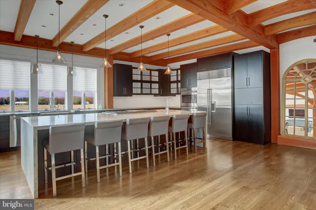 a living room with a fireplace and a rug