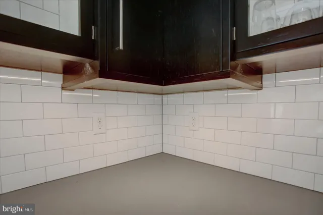 a bathroom with 2 sink and a mirror