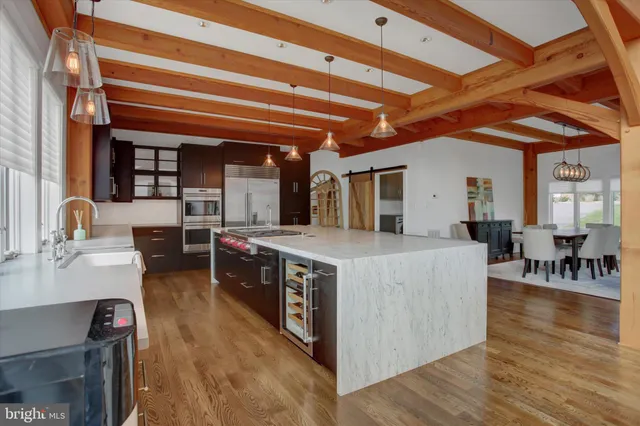 a view of staircase with furniture and a window