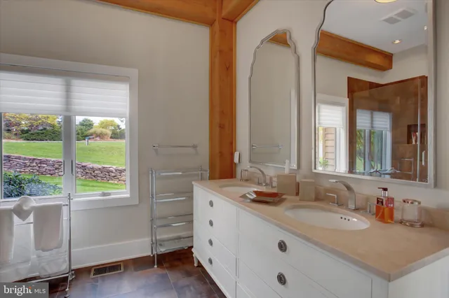 a spacious bedroom with a bed and a couch