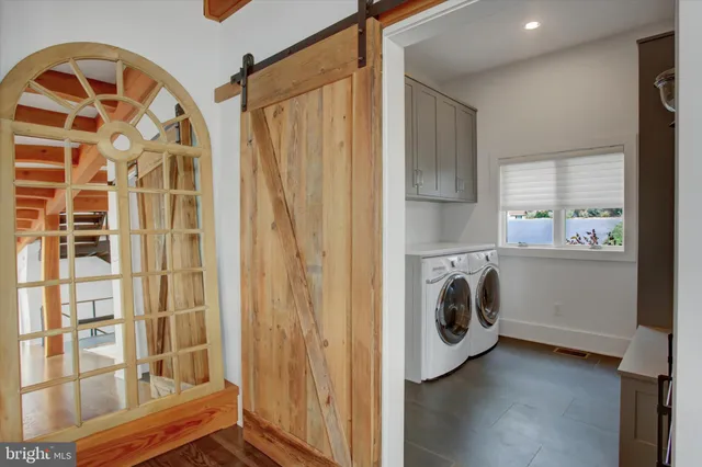 a view of a big house with a big yard and large trees