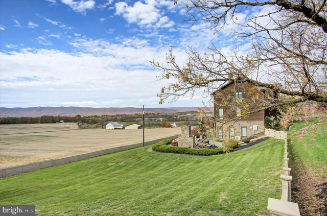a view of a a dining room with furniture window and wooden floor