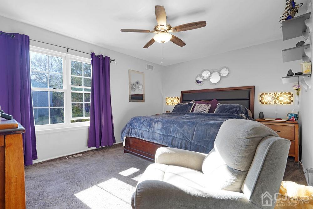 71 Winchester Way Somerset, NJ 08873 - Photo 16 of 24 a bedroom with a bed couch and window
