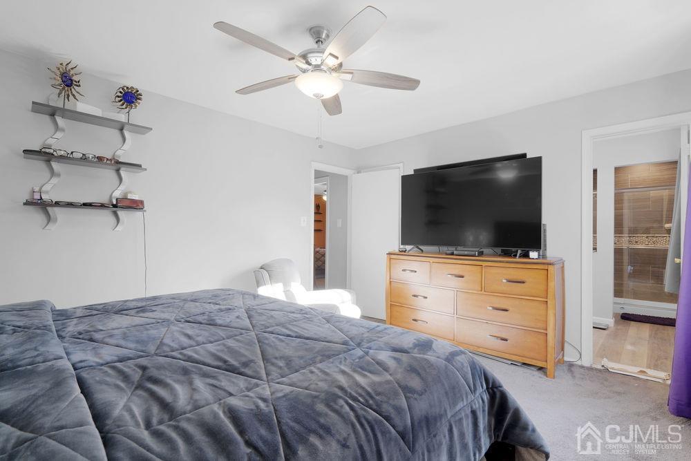 71 Winchester Way Somerset, NJ 08873 - Photo 17 of 24 a bedroom with a bed tv and a dresser