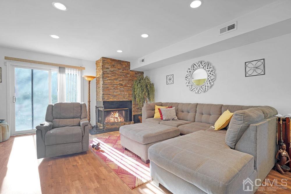 71 Winchester Way Somerset, NJ 08873 - Photo 3 of 24 a living room with furniture and a fireplace