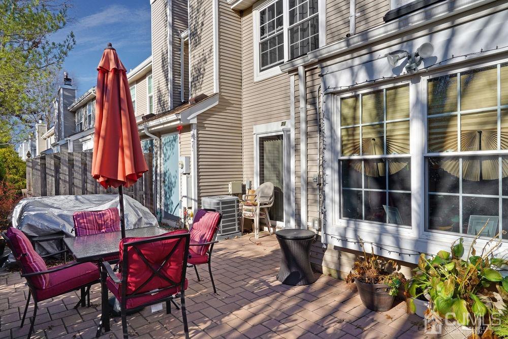 71 Winchester Way Somerset, NJ 08873 - Photo 22 of 24 a view of a dinning tables and chairs in the patio
