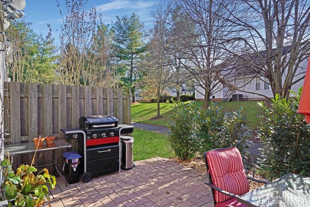 71 Winchester Way Somerset, NJ 08873 - Photo 23 of 24 a view of a yard with furniture and a bench