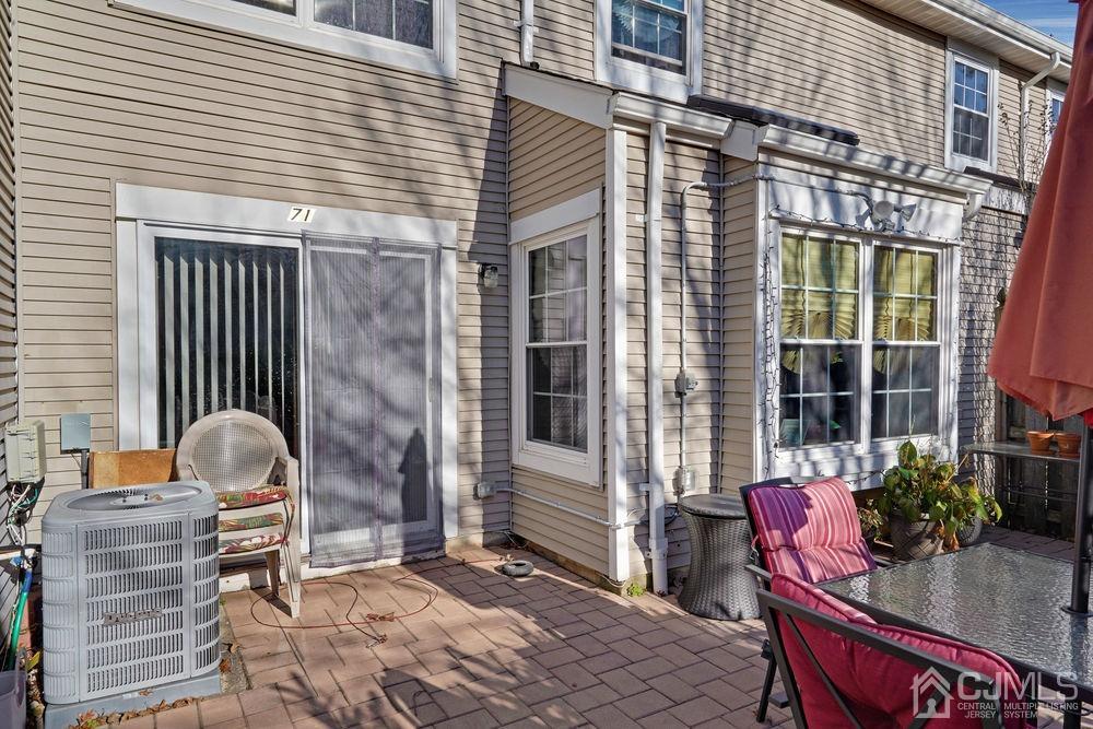 71 Winchester Way Somerset, NJ 08873 - Photo 24 of 24 a backyard of a house with outdoor seating