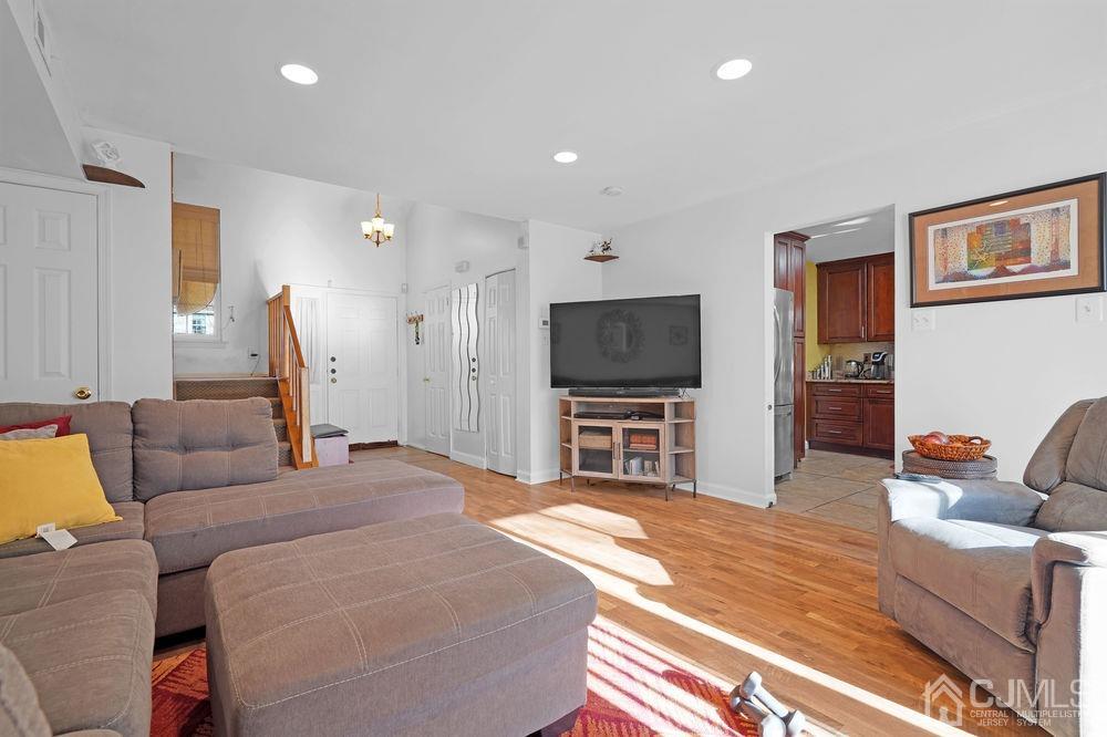 71 Winchester Way Somerset, NJ 08873 - Photo 6 of 24 a bedroom with furniture and a flat screen tv