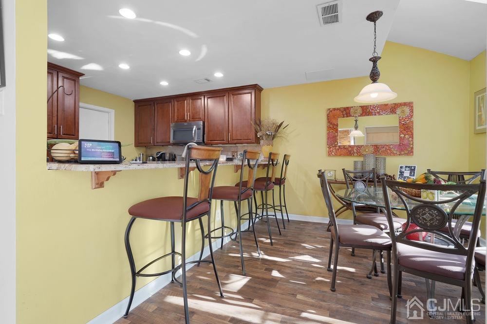 71 Winchester Way Somerset, NJ 08873 - Photo 9 of 24 a view of a dining room with furniture and chandelier