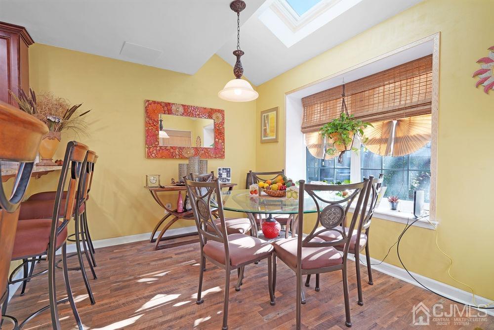 71 Winchester Way Somerset, NJ 08873 - Photo 10 of 24 a view of a dining room with furniture and wooden floor