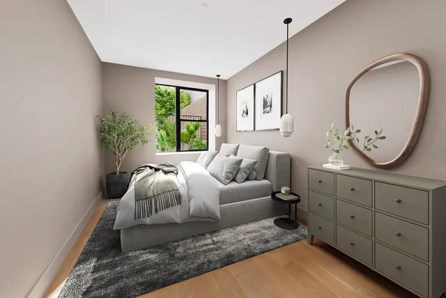 a bedroom with a bed and a dresser