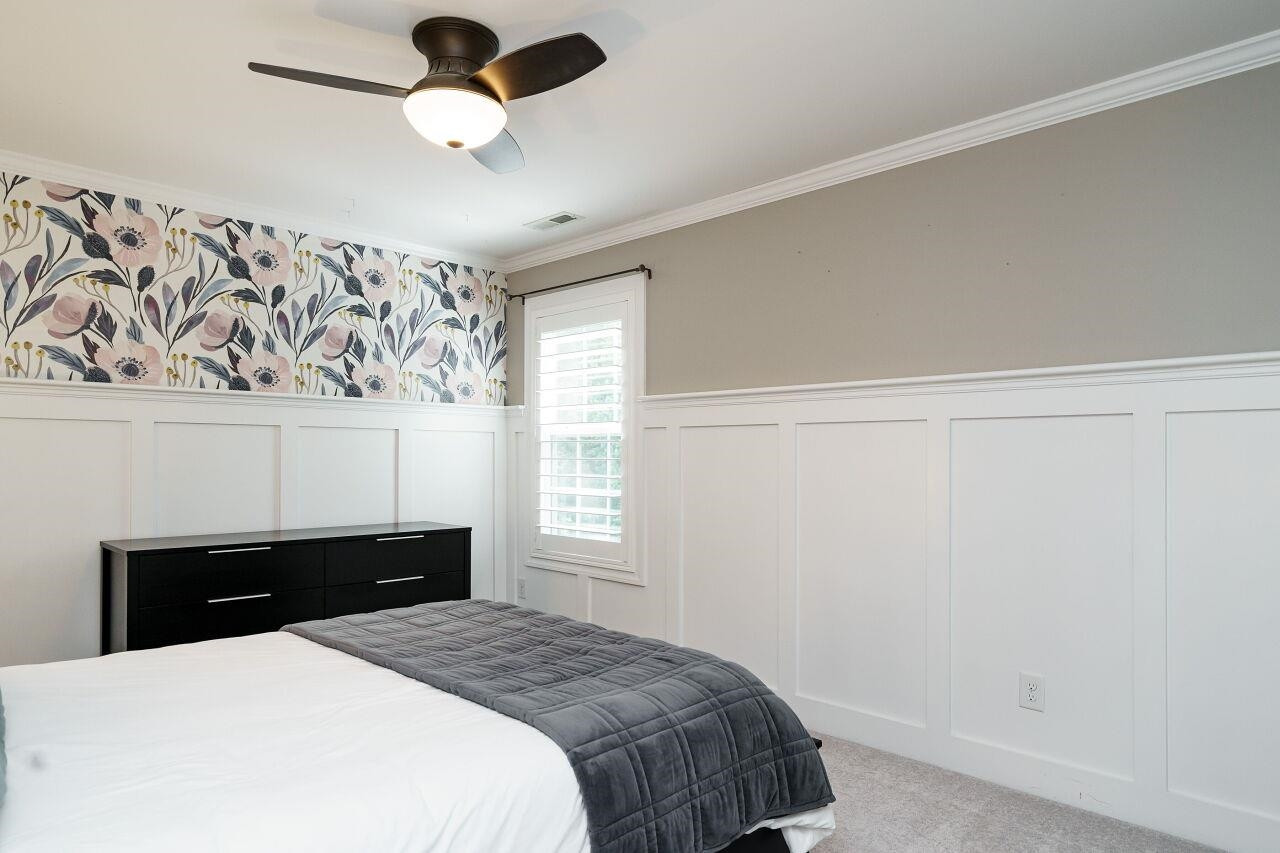 3003 Red Grape Drive Raleigh, NC 27607 - Photo 25 of 35 Already decorated upstairs bedroom with custom trim work and designer wallpaper! Secondary Bedroom