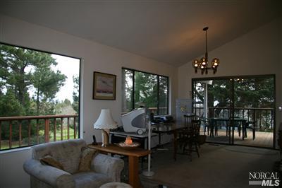 7555 Kennedy Road Sebastopol, CA 95472 - Photo 2 of 11 a living room with furniture and a floor to ceiling window