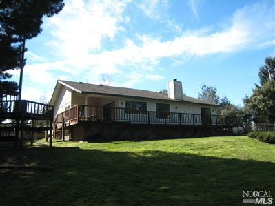 7555 Kennedy Road Sebastopol, CA 95472 - Photo 7 of 11 a view of a house next to a big yard