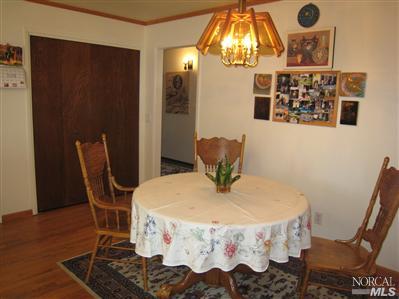 7555 Kennedy Road Sebastopol, CA 95472 - Photo 10 of 11 a dining room with furniture and wooden floor
