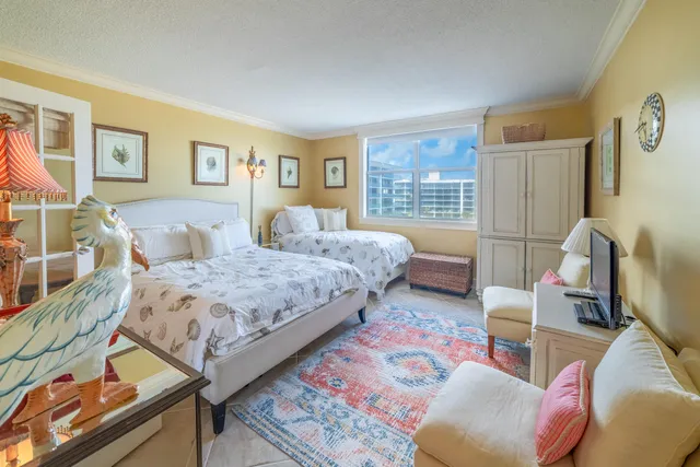 a bedroom with bed and a couch