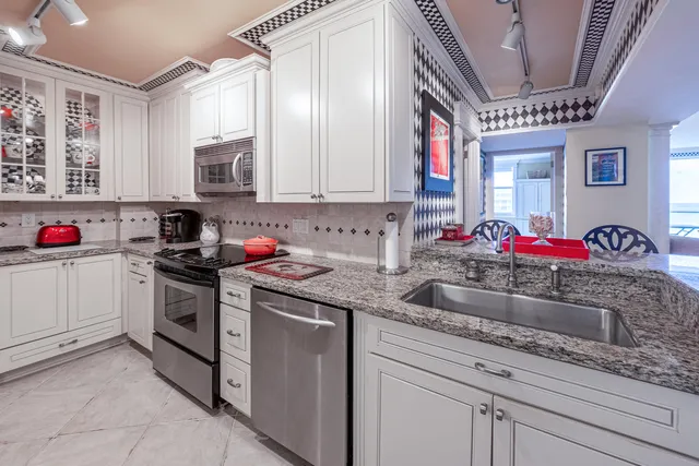 a kitchen with cabinets and window