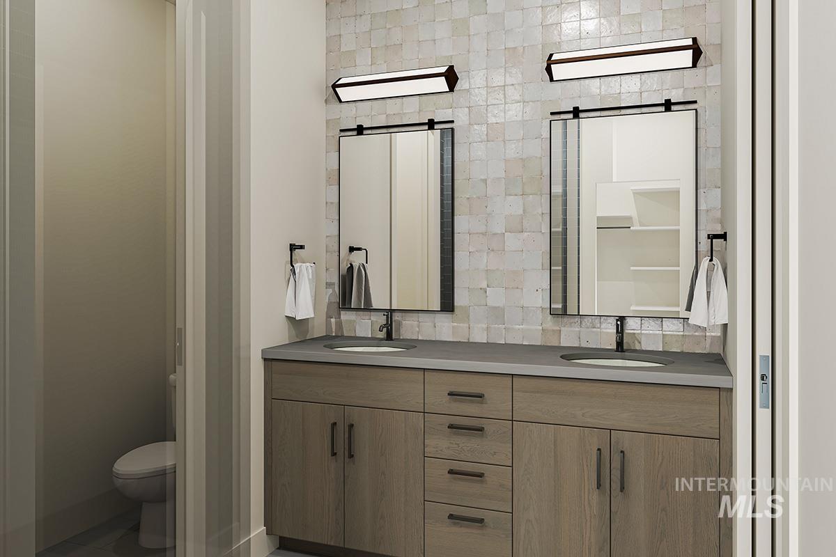 4 Dockside Circle Donnelly, ID 83615 - Photo 11 of 16 Bathroom featuring double vanity and toilet