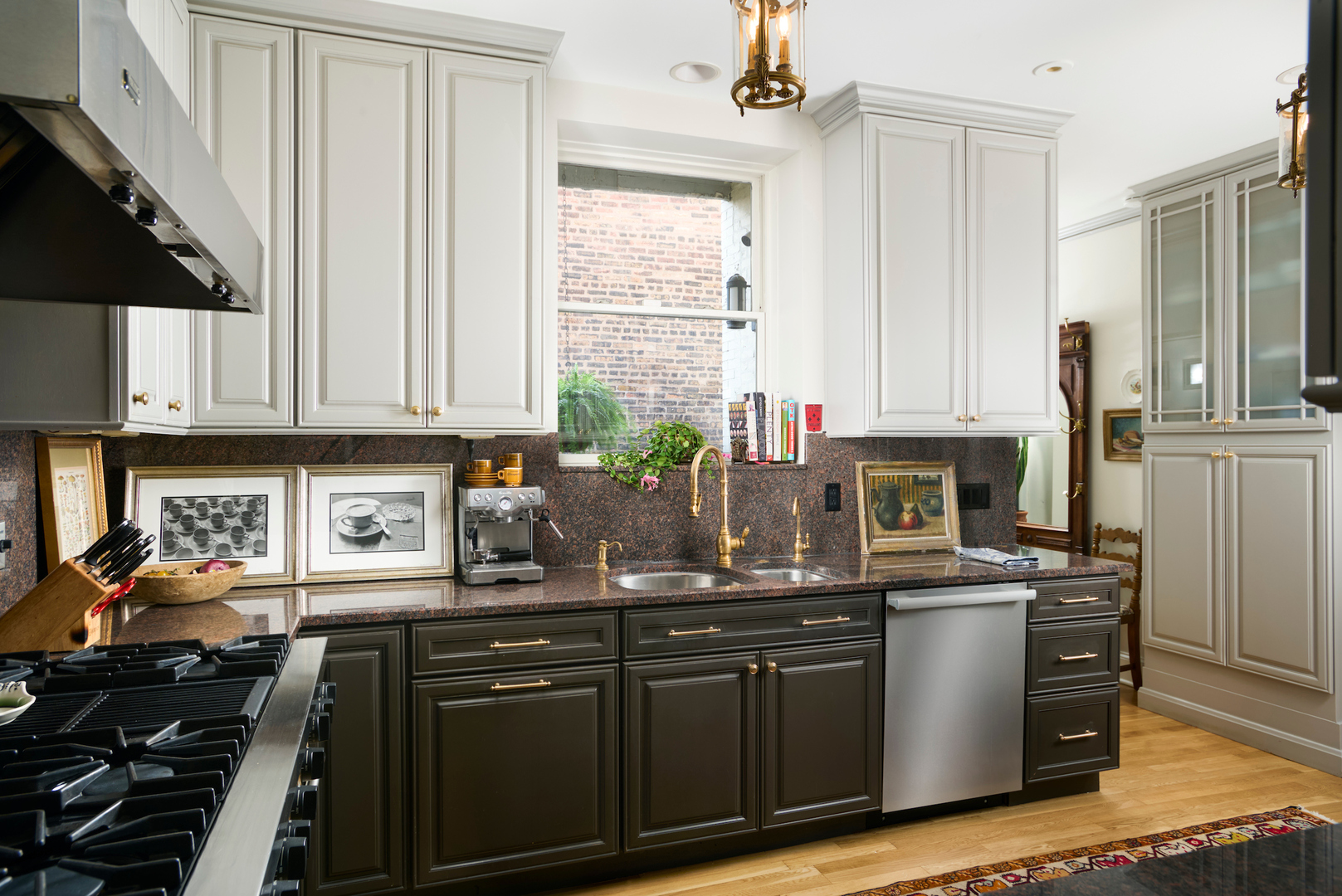 635 West Sheridan Road, Unit 3 Chicago, IL 60613 - Photo 19 of 48 a kitchen with stainless steel appliances granite countertop a stove a sink and a white cabinets