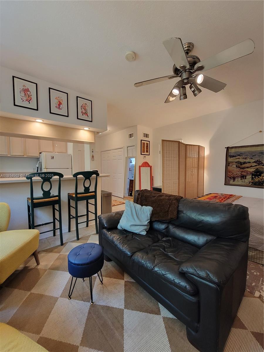 359 Meridian Avenue, Unit A103 Miami Beach, FL 33139 - Photo 14 of 22 a living room with furniture