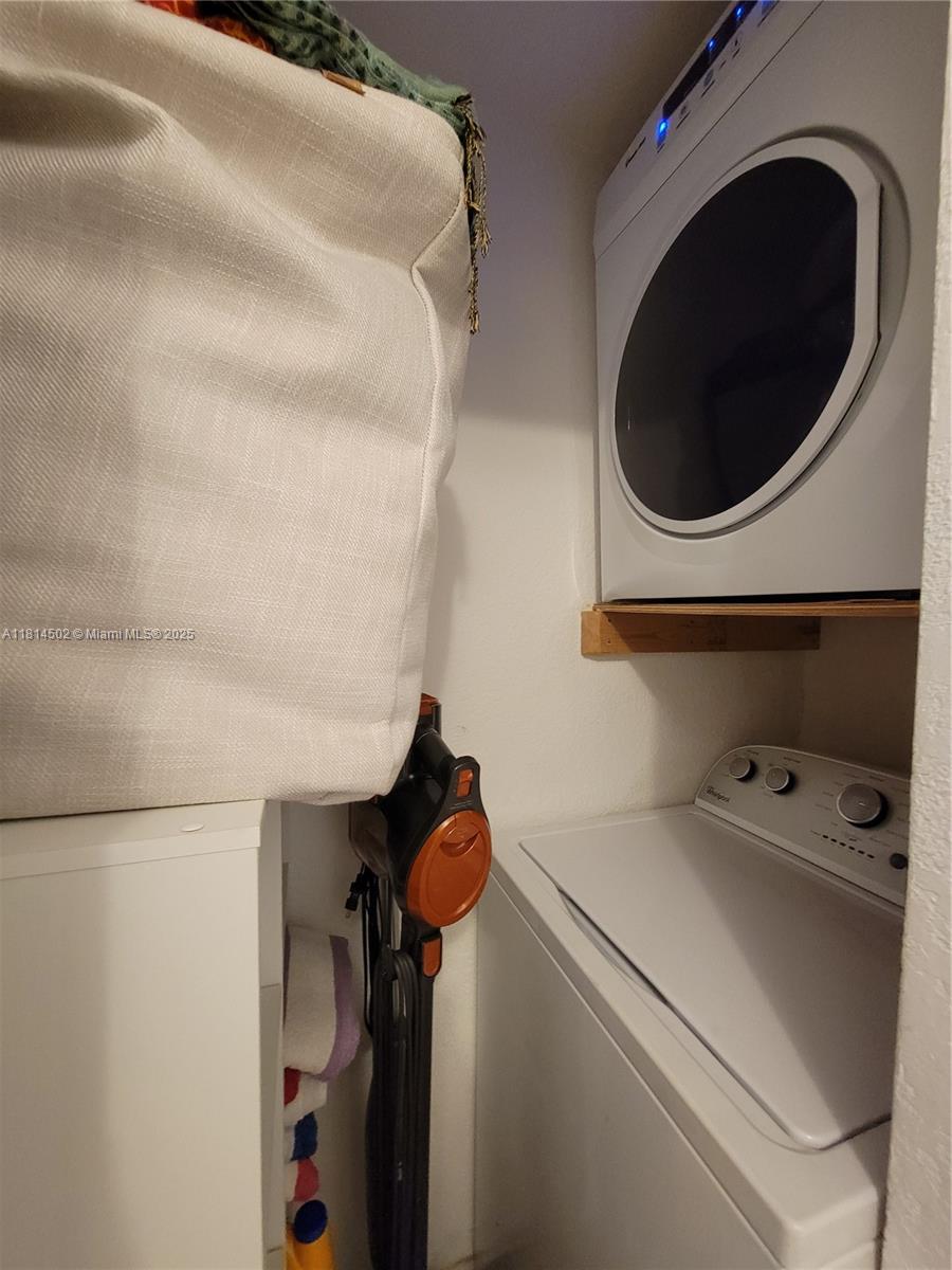 359 Meridian Avenue, Unit A103 Miami Beach, FL 33139 - Photo 18 of 22 a close view of a utility room with dryer and washer