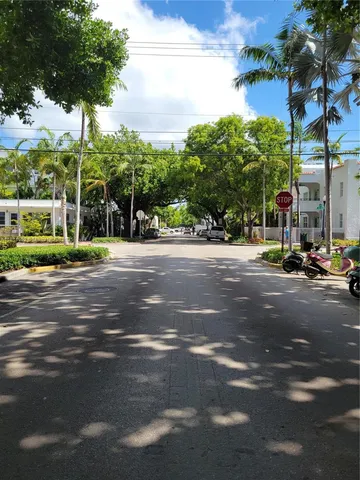 a view of street with houses and trees