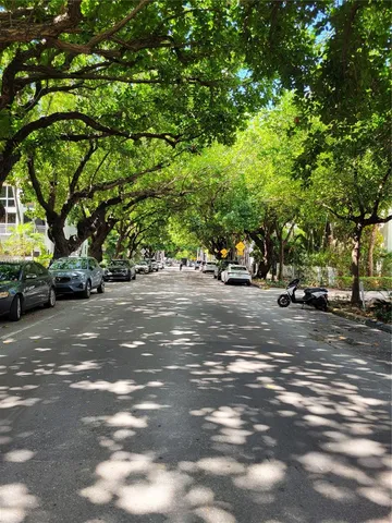 a view of street with parked cars