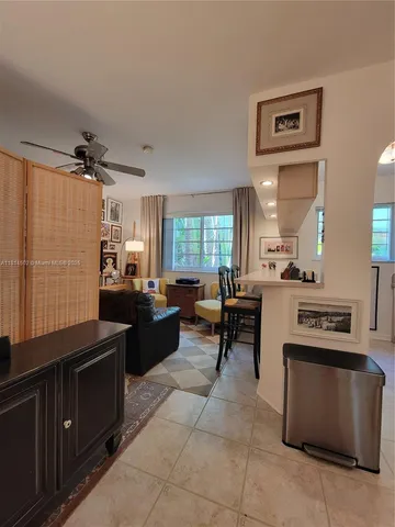 a kitchen with a stove a refrigerator and a sink