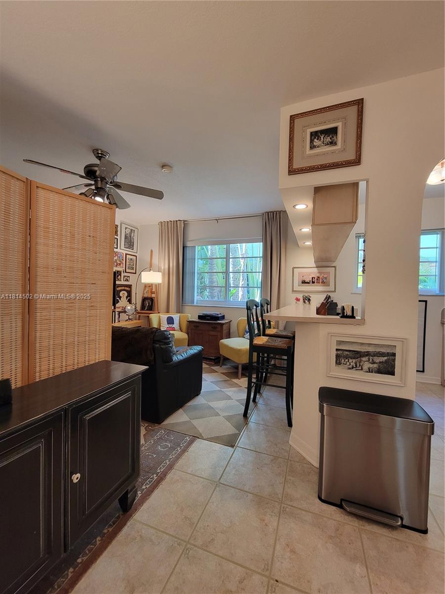 359 Meridian Avenue, Unit A103 Miami Beach, FL 33139 - Photo 6 of 22 a kitchen with a stove a refrigerator and a sink