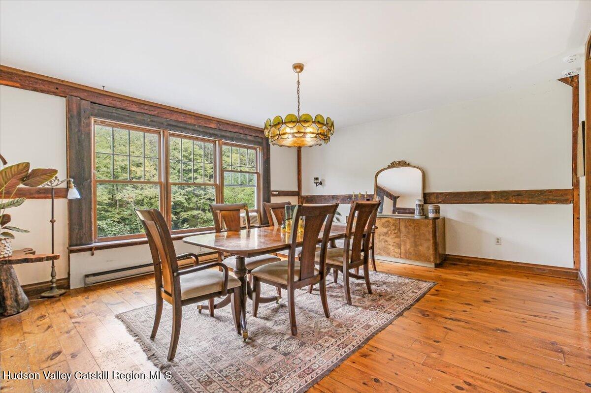 5 Longview Road Clinton, NY 12514 - Photo 12 of 44 a view of a dining room with furniture window and wooden floor