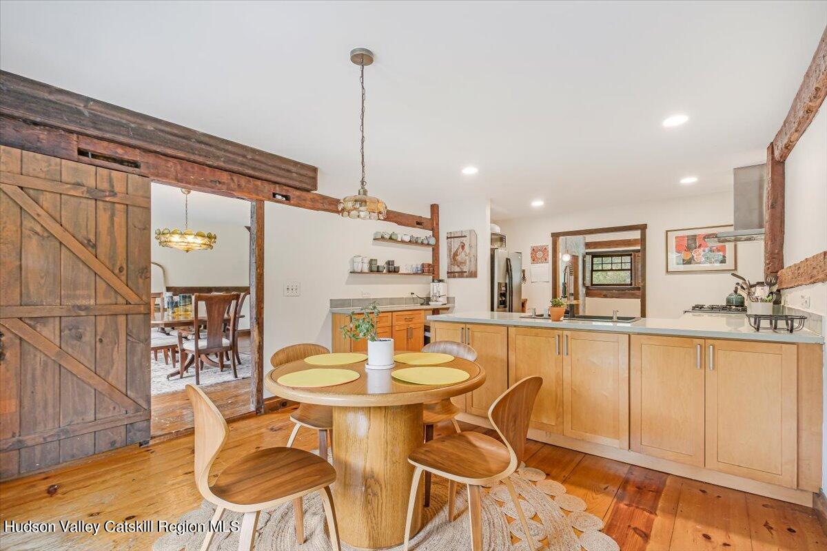 5 Longview Road Clinton, NY 12514 - Photo 14 of 44 a kitchen with stainless steel appliances kitchen island granite countertop a table and chairs in it