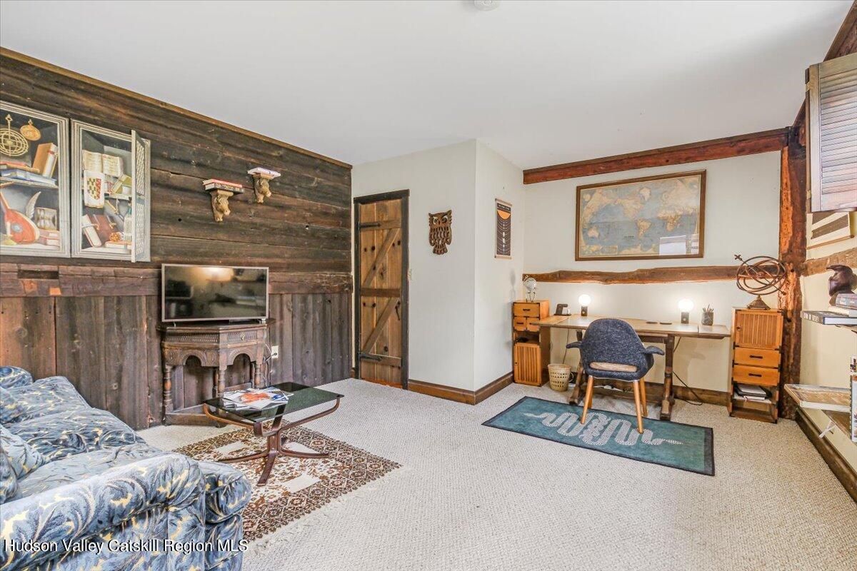 5 Longview Road Clinton, NY 12514 - Photo 19 of 44 a living room with furniture and a flat screen tv