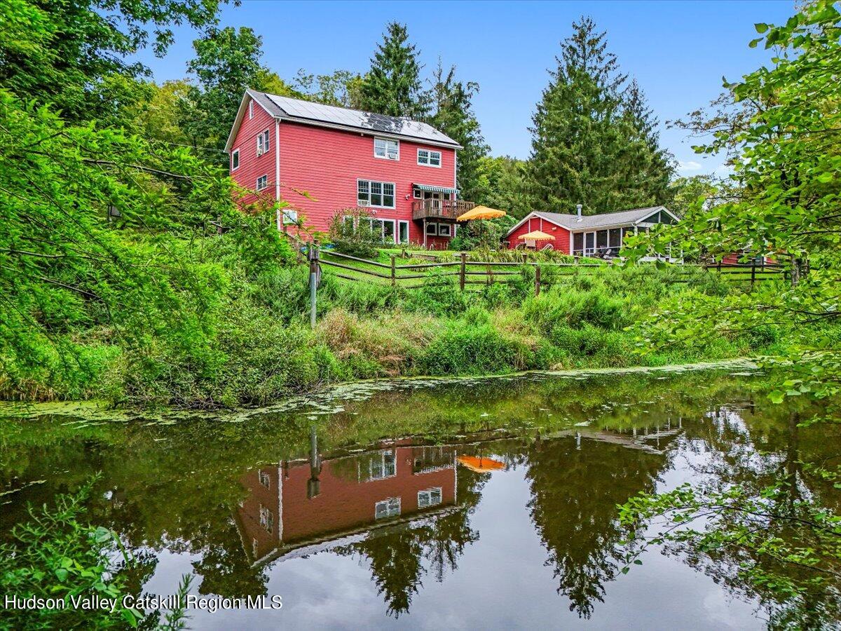 5 Longview Road Clinton, NY 12514 - Photo 4 of 44 a view of a house with a yard and a pond