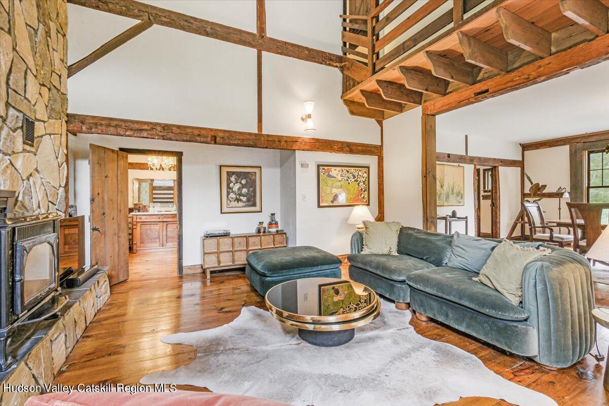 5 Longview Road Clinton, NY 12514 - Photo 9 of 44 a living room with furniture a wooden floor and a flat screen tv
