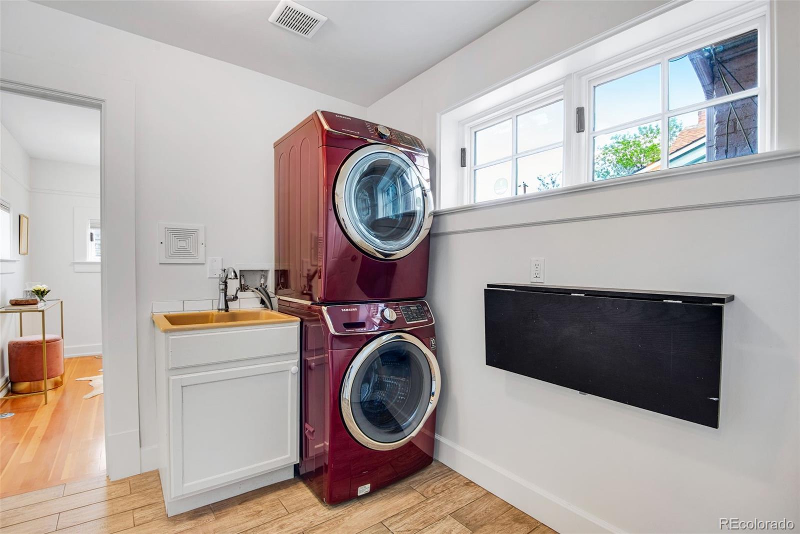 2815 Curtis Street Denver, CO 80205 - Photo 15 of 48 a utility room with dryer and washer