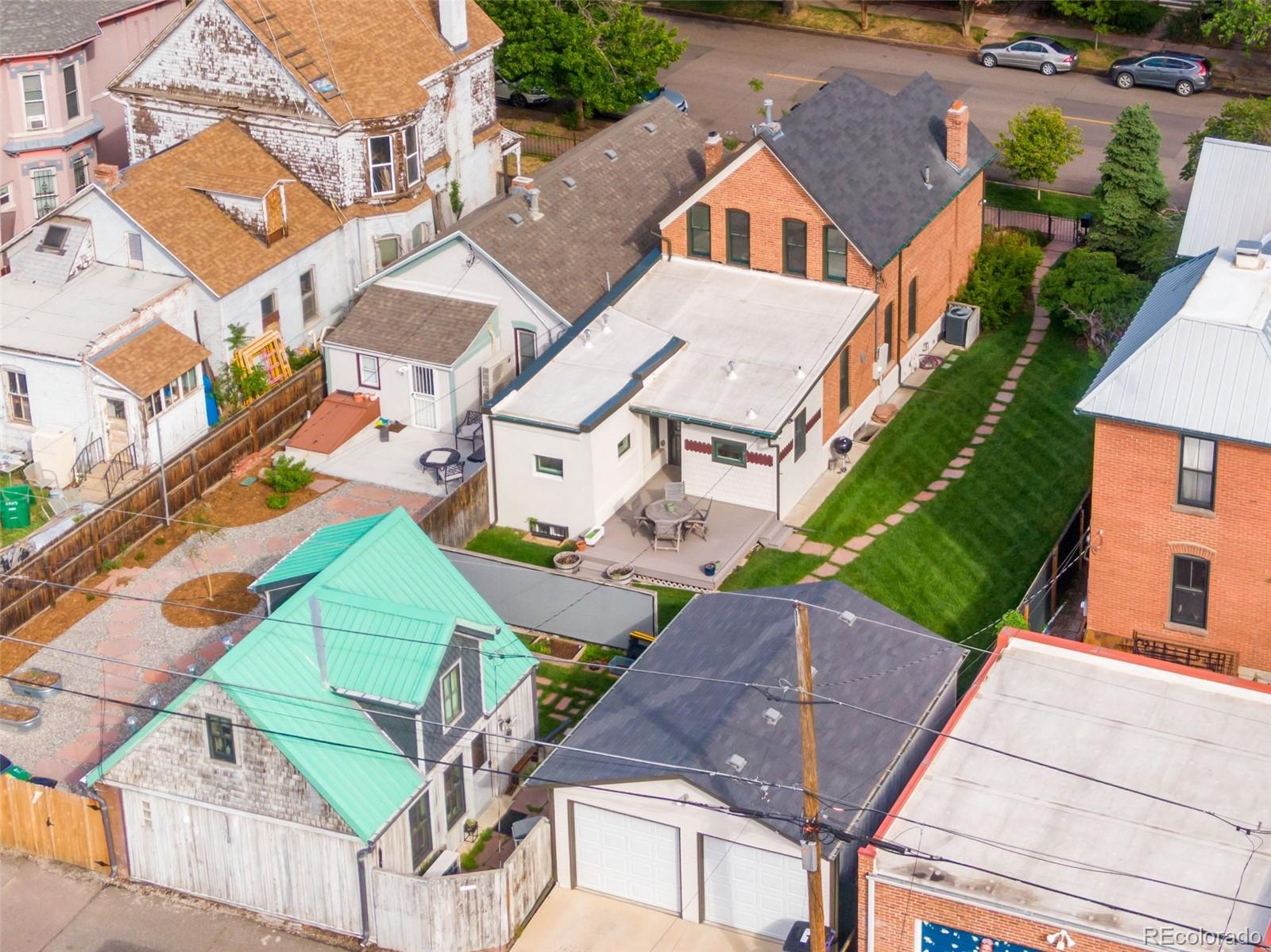 2815 Curtis Street Denver, CO 80205 - Photo 31 of 48 an aerial view of a house with a yard