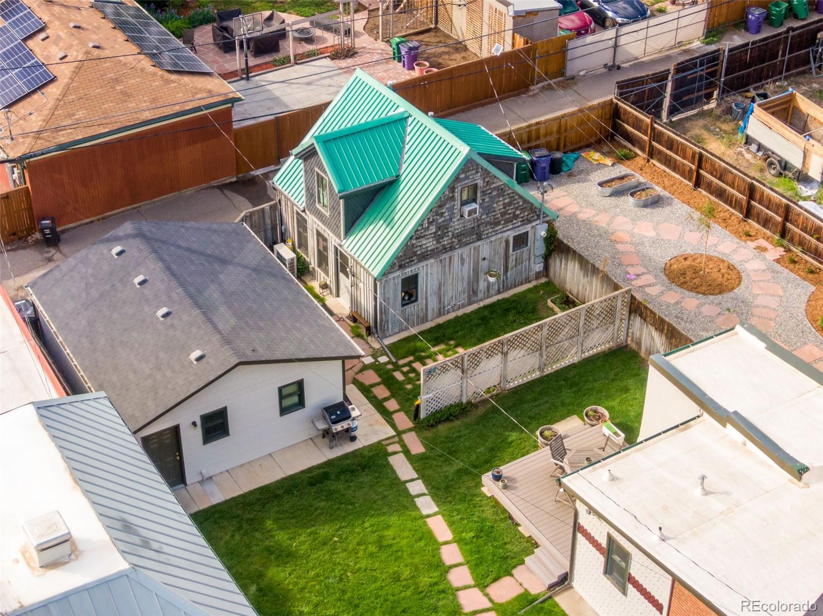 2815 Curtis Street Denver, CO 80205 - Photo 32 of 48 an aerial view of a house with a yard