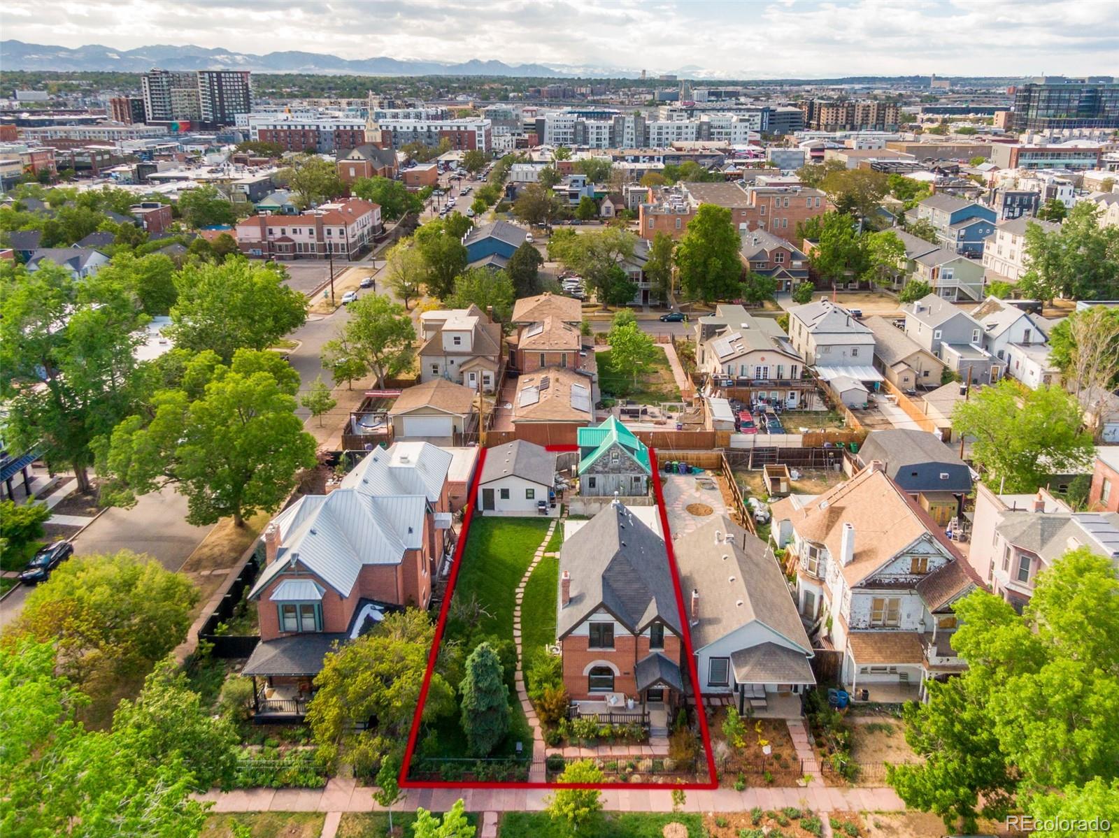 2815 Curtis Street Denver, CO 80205 - Photo 43 of 48 an aerial view of residential houses with outdoor space