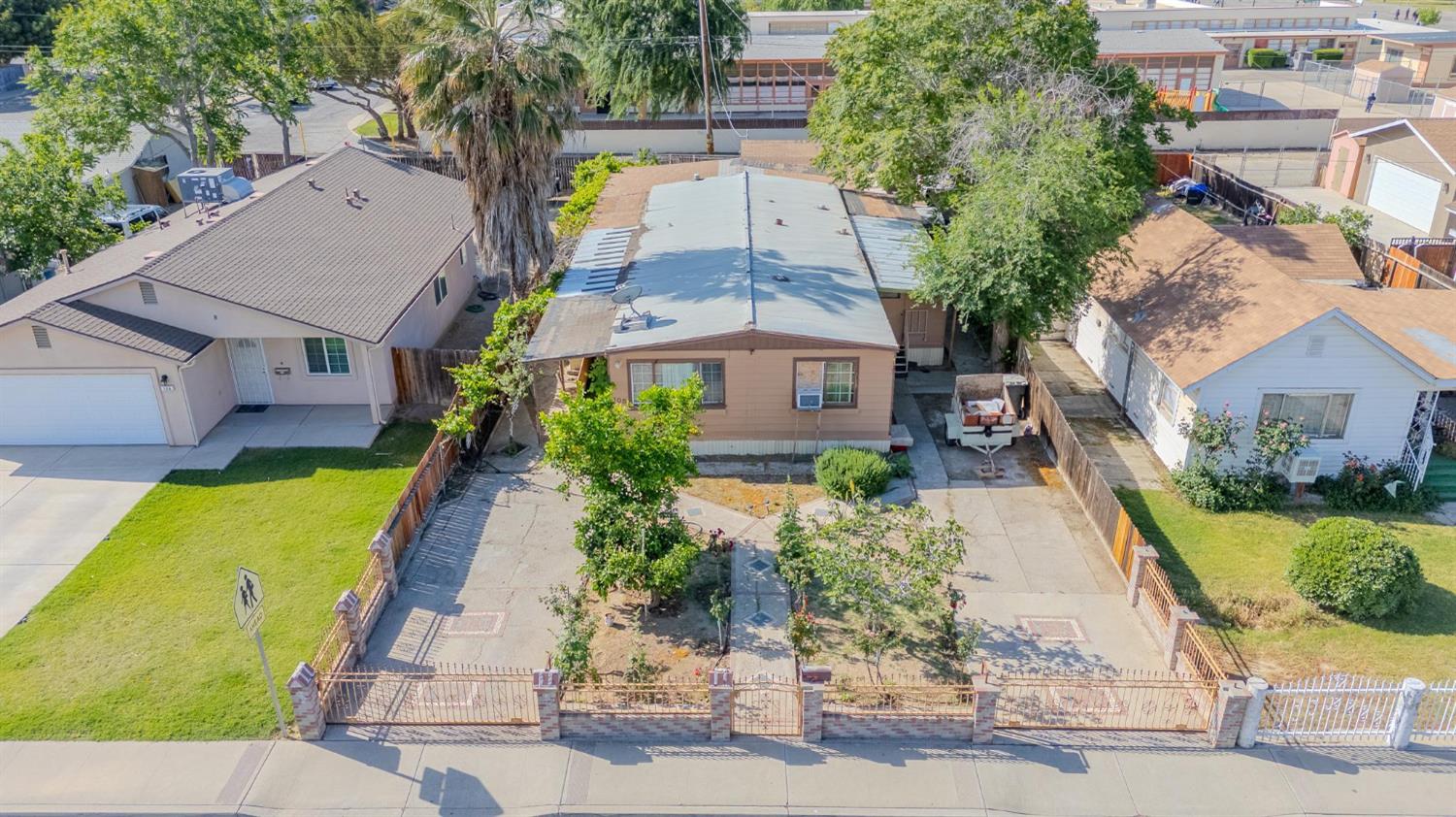 an aerial view of a house with swimming pool