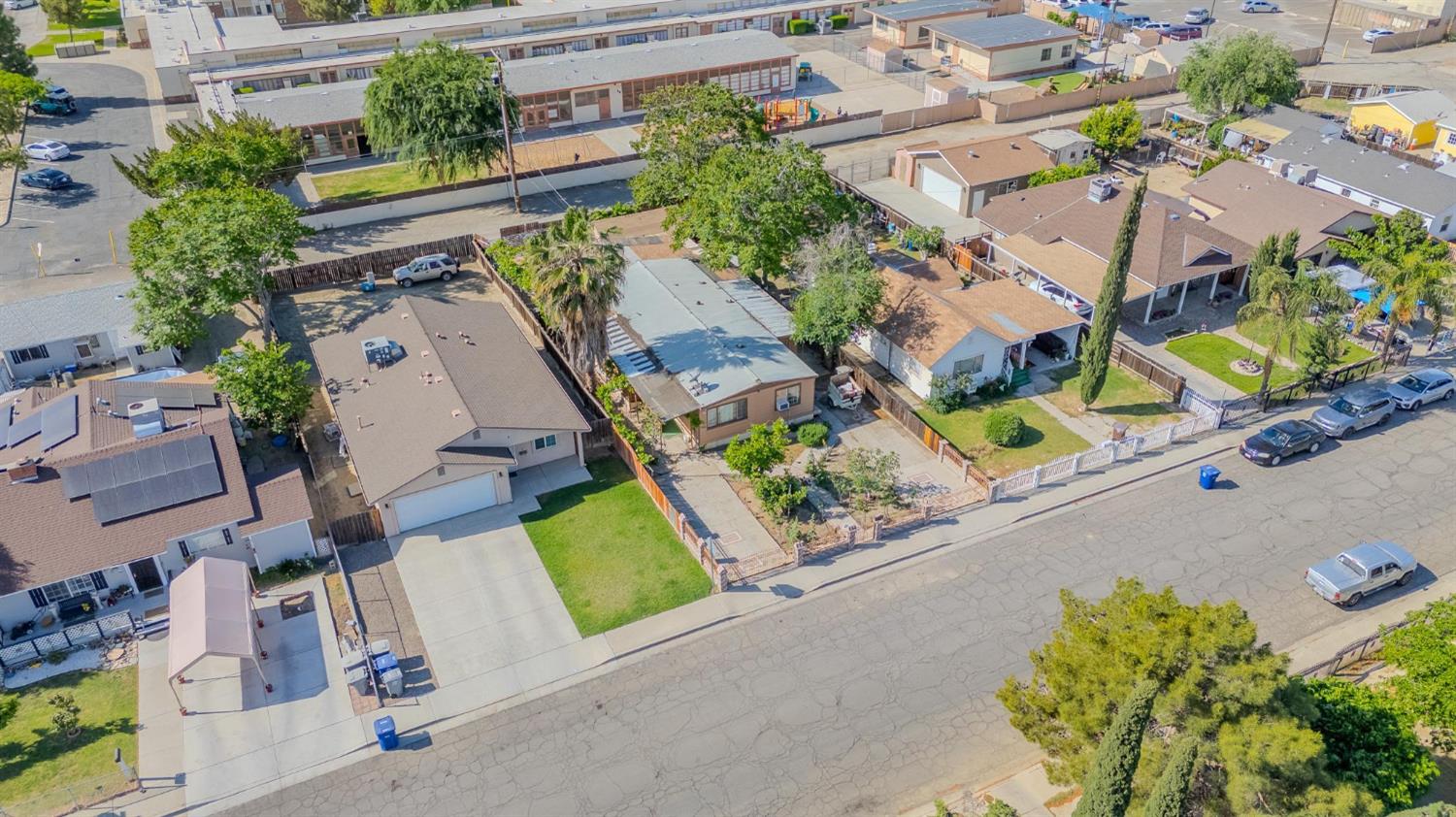 108 West Merced Street Avenal, CA 93204 - Photo 4 of 11 an aerial view of a house with a swimming pool