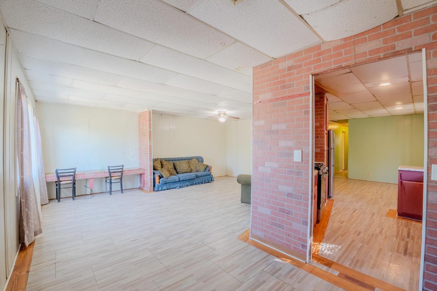 108 West Merced Street Avenal, CA 93204 - Photo 6 of 11 a view of empty room with wooden floor