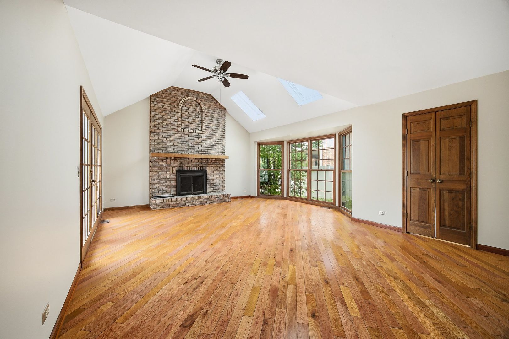 1333 Sable Drive Addison, IL 60101 - Photo 12 of 29 a view of empty room with wooden floor and fireplace