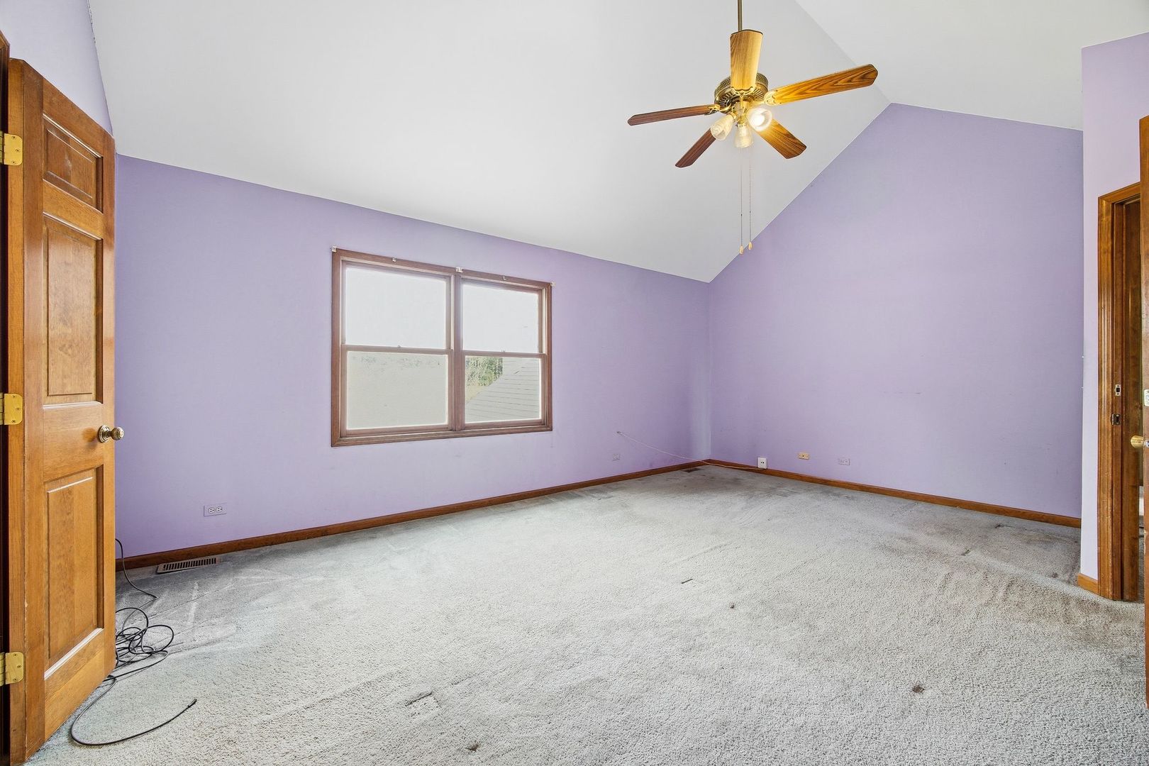 1333 Sable Drive Addison, IL 60101 - Photo 19 of 29 an empty room with a window and a ceiling fan