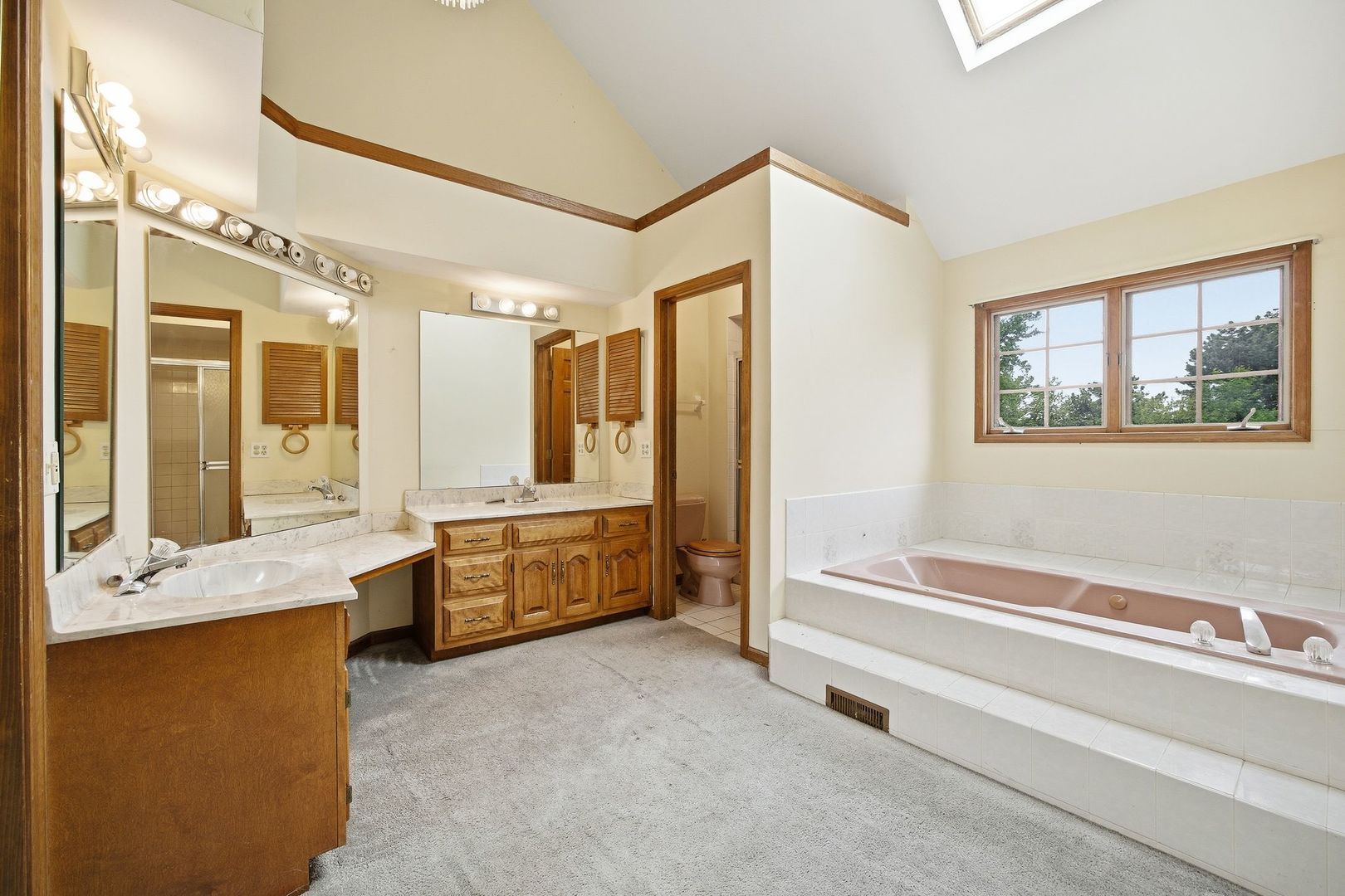 1333 Sable Drive Addison, IL 60101 - Photo 20 of 29 a bathroom with a granite countertop tub sink shower and mirror