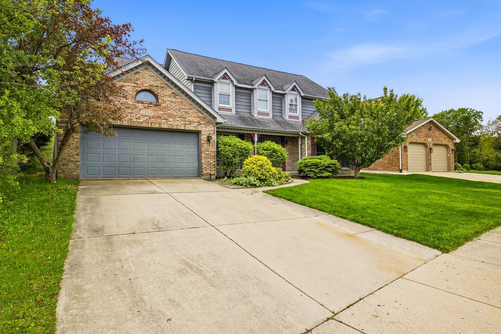 1333 Sable Drive Addison, IL 60101 - Photo 2 of 29 a front view of a house with garden