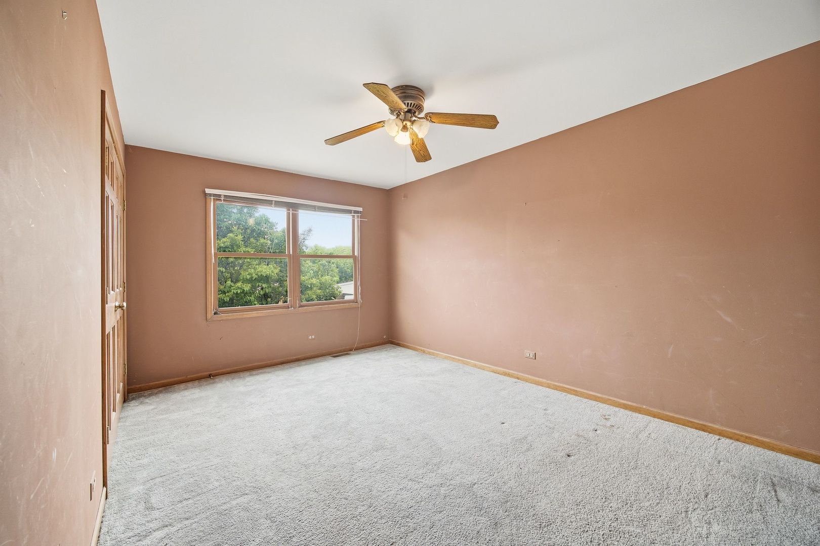 1333 Sable Drive Addison, IL 60101 - Photo 21 of 29 an empty room with a window and a ceiling fan
