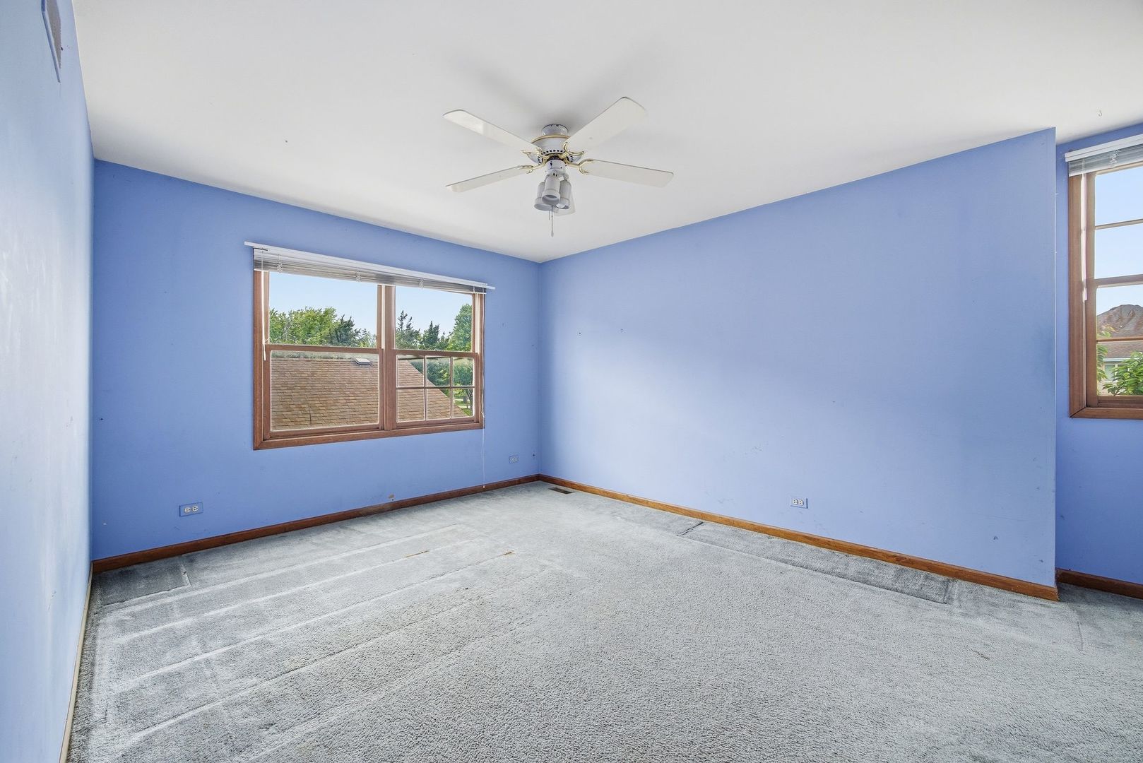 1333 Sable Drive Addison, IL 60101 - Photo 22 of 29 an empty room with windows and ceiling fan